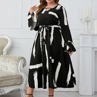 Melo Apparel Plus Size Printed Tie Belt Flare Sleeve Round Neck Midi Dress