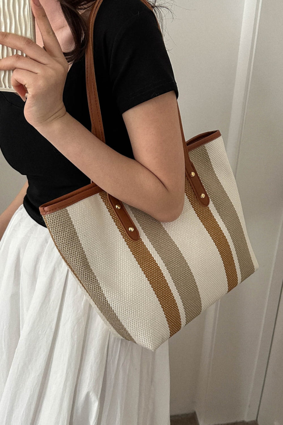 Tan and white stripe bag