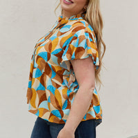 And The Why Full Size Printed Ruffle Baby Doll Top