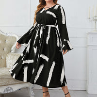 Melo Apparel Plus Size Printed Tie Belt Flare Sleeve Round Neck Midi Dress